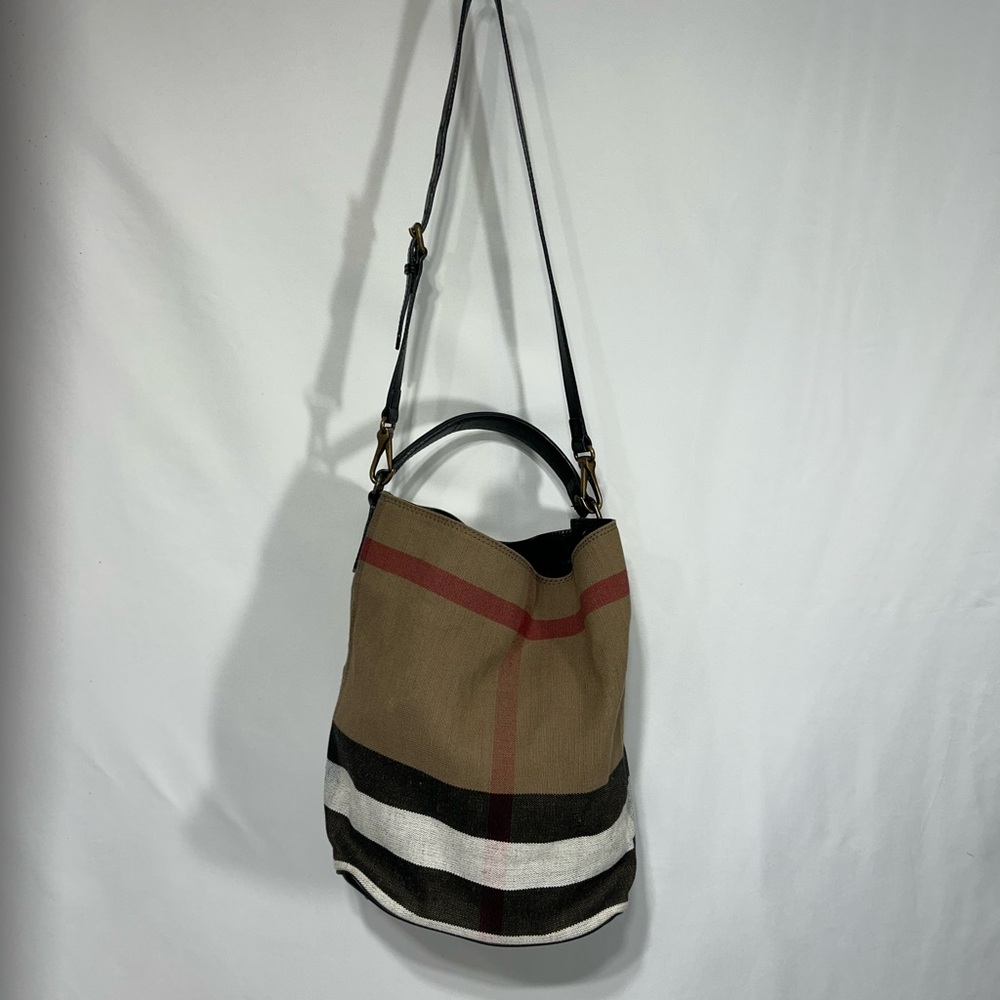 Authentic Burberry bucket bag with leather strap and removable pouch.